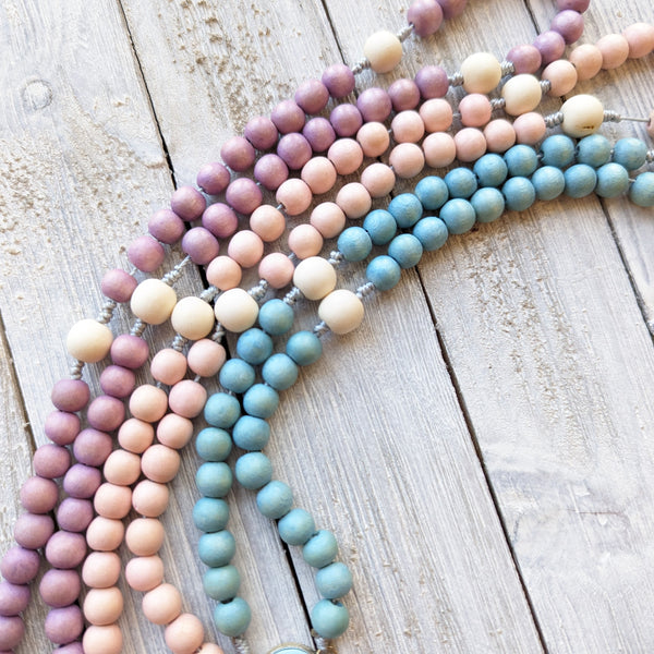 Pastel Corded Blessed Mother Rosary with painted wood beads, nylon cording, scultured resin center