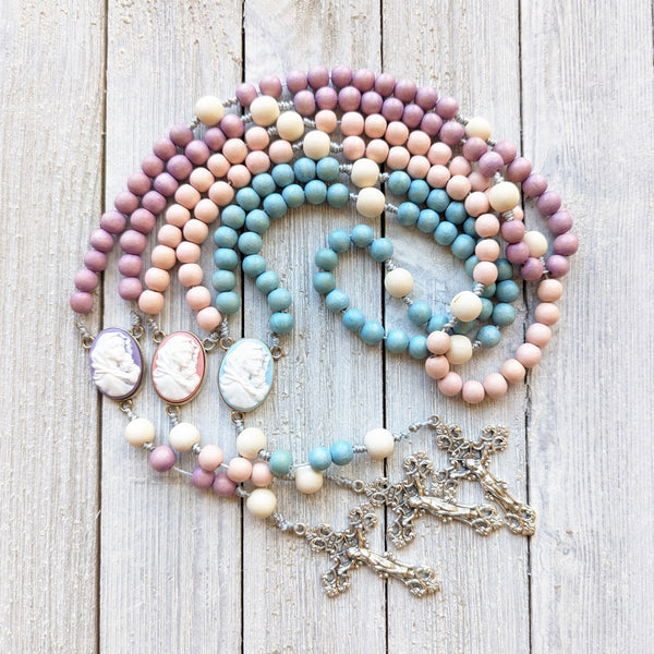 Pastel Corded Blessed Mother Rosary with painted wood beads, nylon cording, scultured resin center