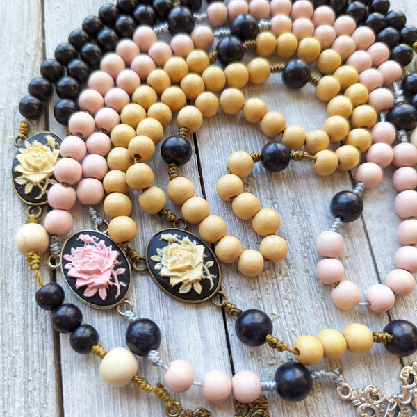 Corded Rose Rosary with painted wood beads, nylon cording, scultured resin center