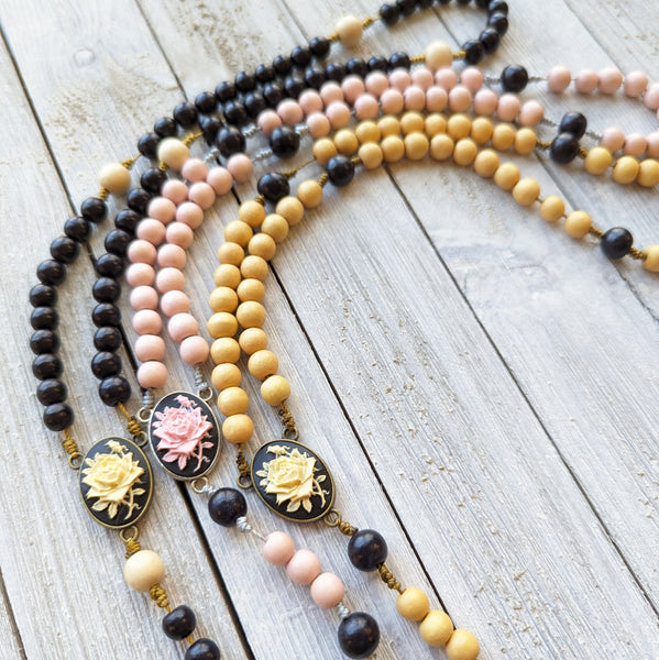 Corded Rose Rosary with painted wood beads, nylon cording, scultured resin center