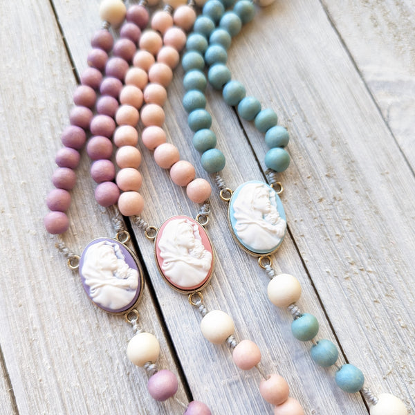 Pastel Corded Blessed Mother Rosary with painted wood beads, nylon cording, scultured resin center